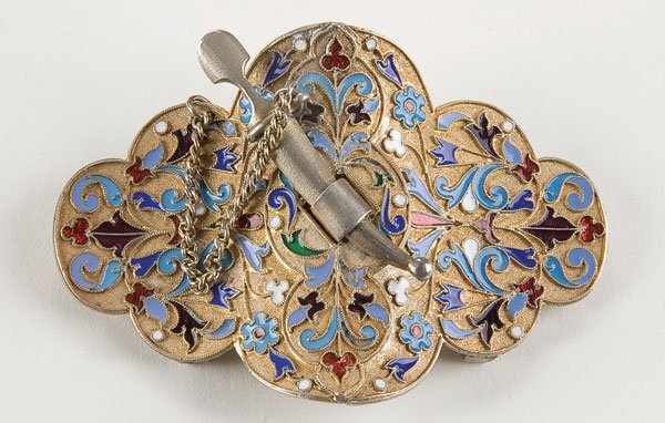 Russian silver-gilt and enamel belt buckle: A RUSSIAN SILVER-GILT AND ENAMEL TWO-PIECE BELT BUCKLE, St. Petersburg circa 1890, 84 standard and with indistinguishable Cyrillic maker's mark. Length 3 inches (7.2 cm). Estimate $300-$500