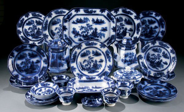 Wedgwood Flow Blue Dinnerware Chapoo: A WEDGWOOD FLOW BLUE ''CHAPOO'' PARTIAL DINNERWARE SET mid 19th century 30 pieces. Comprising two coffee pots, 14 inch platter, vegetable bowl, covered sugar, 3 soup plates, 4 tea cups, 3 saucers, 2 c