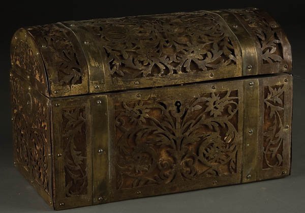GILT BRONZE & ROSEWOOD DOMED CASKET: A GILT BRONZE AND ROSEWOOD DOMED CASKET 19th century, with allover scrolling gilt bronze decoration. Height 7 inches, length 10 inches.
