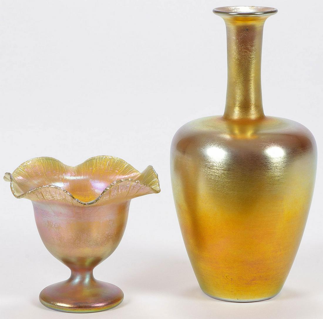 VINTAGE IRIDIZED ART GLASS: VINTAGE IRIDIZED ART GLASS. Comprising a footed Quezal vase with ruffled rim, signed "Quezal" on polished pontil, height 4 inches (10 cm), together with a likely Steuben baluster form vase with long n