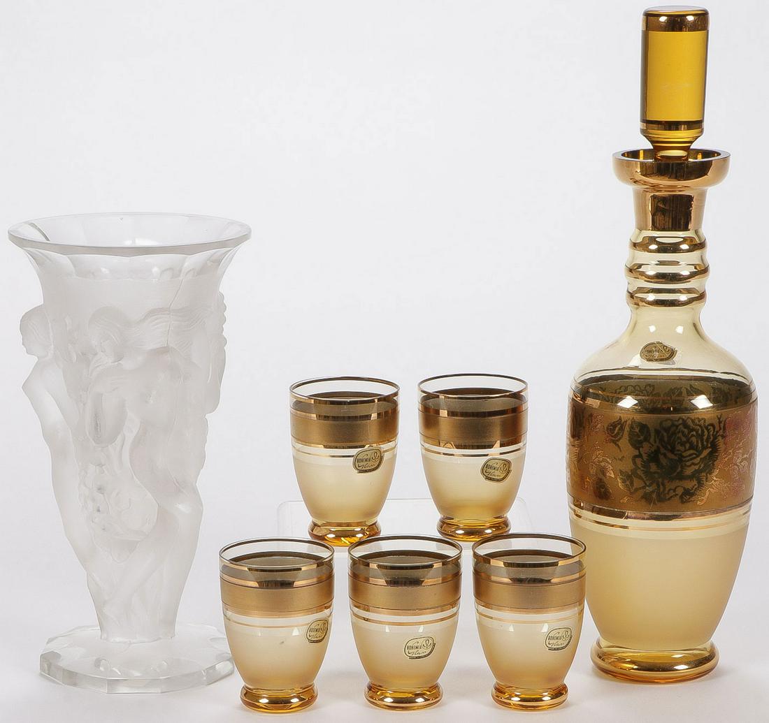 CZECH ART GLASS GROUP: CZECH ART GLASS GROUP. Comprising a Weil Czech frosted glass footed vase banded with nude women, and an amber liquor set with gilt decoration, greatest height 13 inches. SHIPPING NOTICE: Jackson'
