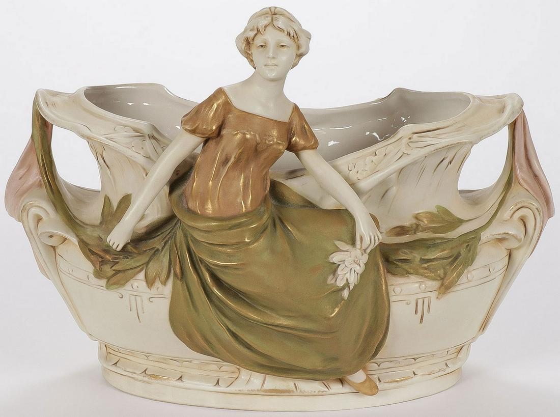 LARGE & IMPRESSIVE ROYAL DUX FIGURAL VASE: LARGE & IMPRESSIVE ROYAL DUX FIGURAL VASE. Comprising a double handled oval vase or planter mounted with a beautiful maiden in the art nouveau taste with gilt highlights, underside with pink triangle 