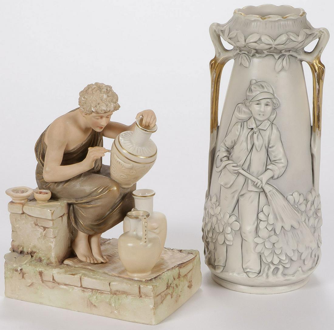 A ROYAL DUX FIGURINE & VASE: A ROYAL DUX FIGURINE & VASE. Comprising a Royal Dux figure of a classical Greek decorating an urn, and an art nouveau double handled vase depicting a child watering flowers. Both with pink triangular 