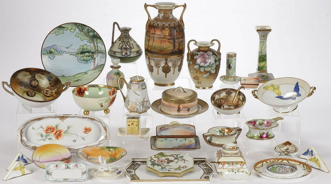 33 PIECES OF NIPPON PORCELAIN: 33 PIECES OF NIPPON PORCELAIN. A cornucopia of various patterns, shapes, styles, and motifs, including a large double handled vase (top center), a rare covered sardine dish, a covered butter, an inkwe