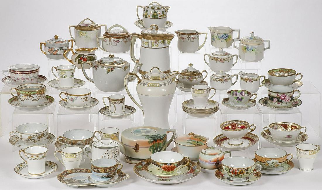 60 PIECES OF NIPPON PORCELAIN: 60 PIECES OF NIPPON PORCELAIN. Comprising over 60 pieces of hand decorated Nippon porcelain including a chocolate pot with four matching cups and saucers, two matching cream and sugars, a three-piece 