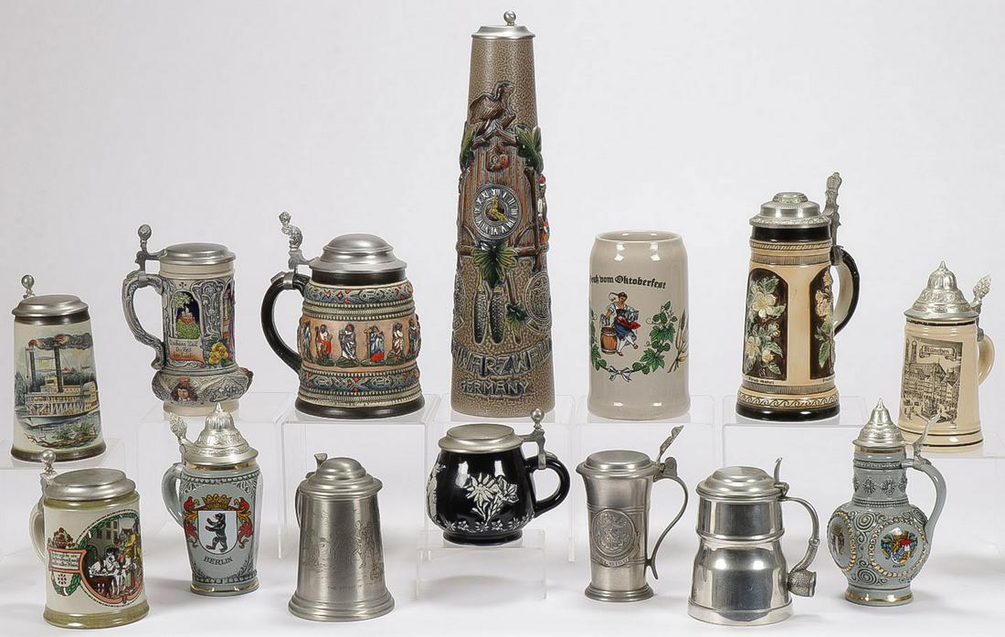 14 BEER STEINS: 14 BEER STEINS. Of various shapes, sizes, and material. Greatest height 17 inches. SHIPPING NOTICE: Jackson's is your sole and only source for one stop packing and shipping. With over 50 years of
