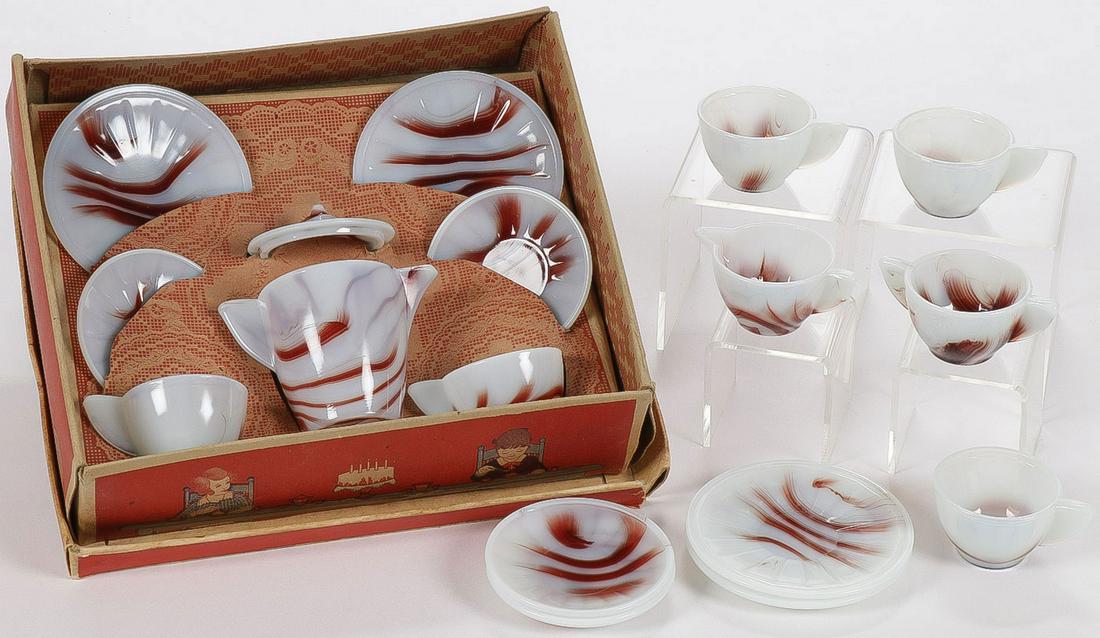 SCARCE CHILD'S AKRO AGATE OXBLOOD TEA SET: SCARCE CHILD'S AKRO AGATE OXBLOOD TEA SET. Comprising an original seven-piece Akro Agate tea set in Okblood with original "Play-time" box, and nine additional pieces including two plates, two saucers,