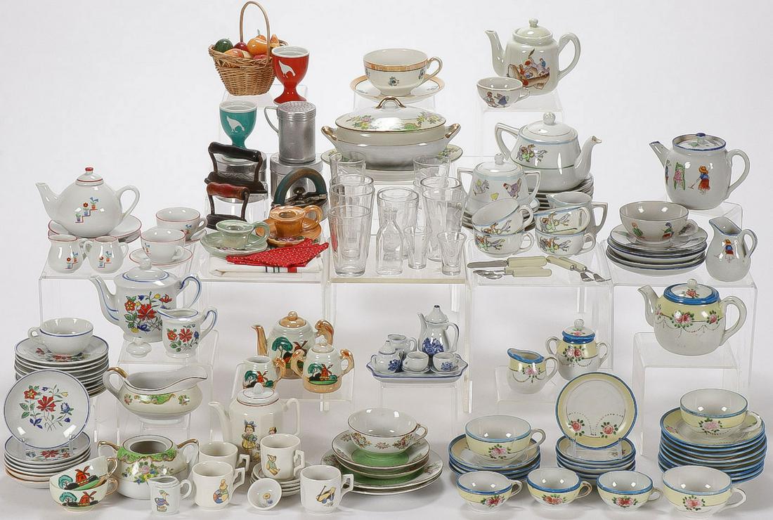 200+ VINTAGE CHILDREN'S DISHES: 200+ VINTAGE CHILDREN'S DISHES. Comprising approximately 229 individual pieces, some full and some partial sets, in porcelain and pressed glass, and children's irons and other kitchen wares, as well a