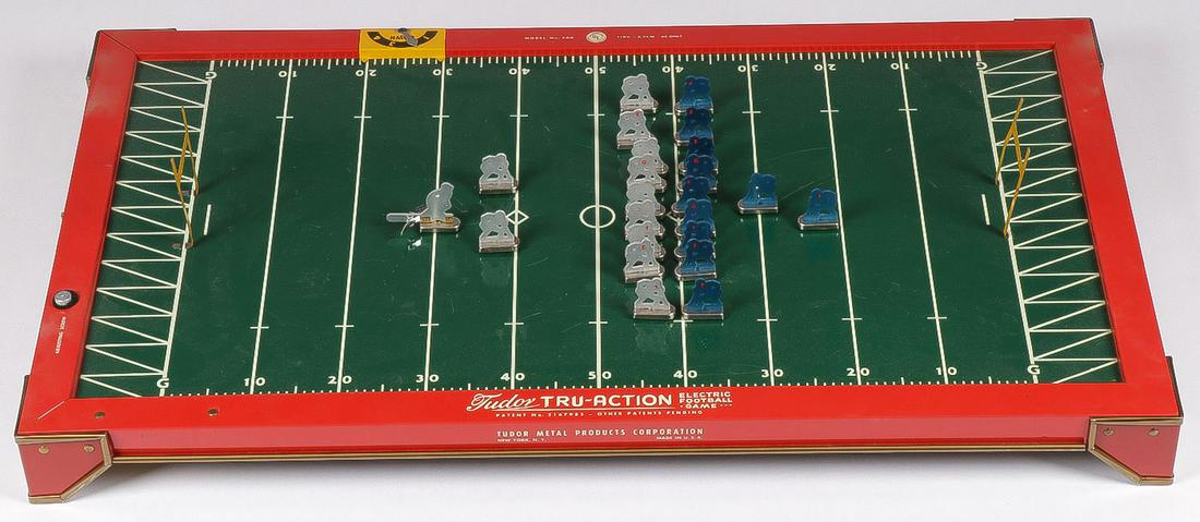 TUDOR ELECTRIC FOOTBALL GAME, C. 1949: TUDOR ELECTRIC FOOTBALL GAME, C. 1949. Comprising a Tudor Tru-Action vibrating electric football game in the original box with the original players and instruction booklet, including four felt footbal