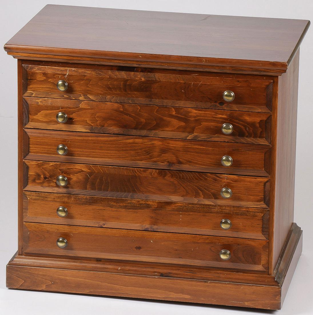 A SIX-DRAWER SPOOL CABINET: A SIX-DRAWER SPOOL CABINET. Comprising a 6-drawer spool cabinet of traditional design with brass pulls. 24.5 inches x 26.75 inches x 17 inches.SHIPPING NOTICE:Jackson's is your sole and only sou