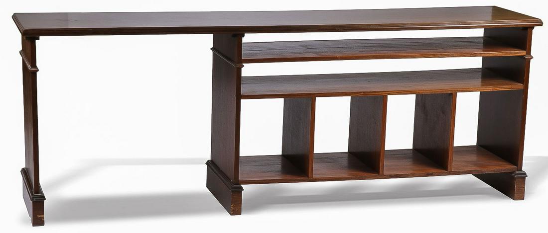 OAK CREDENZA DESK: OAK CREDENZA DESK. Comprising a credenza with two horizontal shelves over four square form cubby holes next to a 30-inch-wide open section. (33.25 inches x 82 inches x 18.25 inches) SHIPPING NOTICE: J