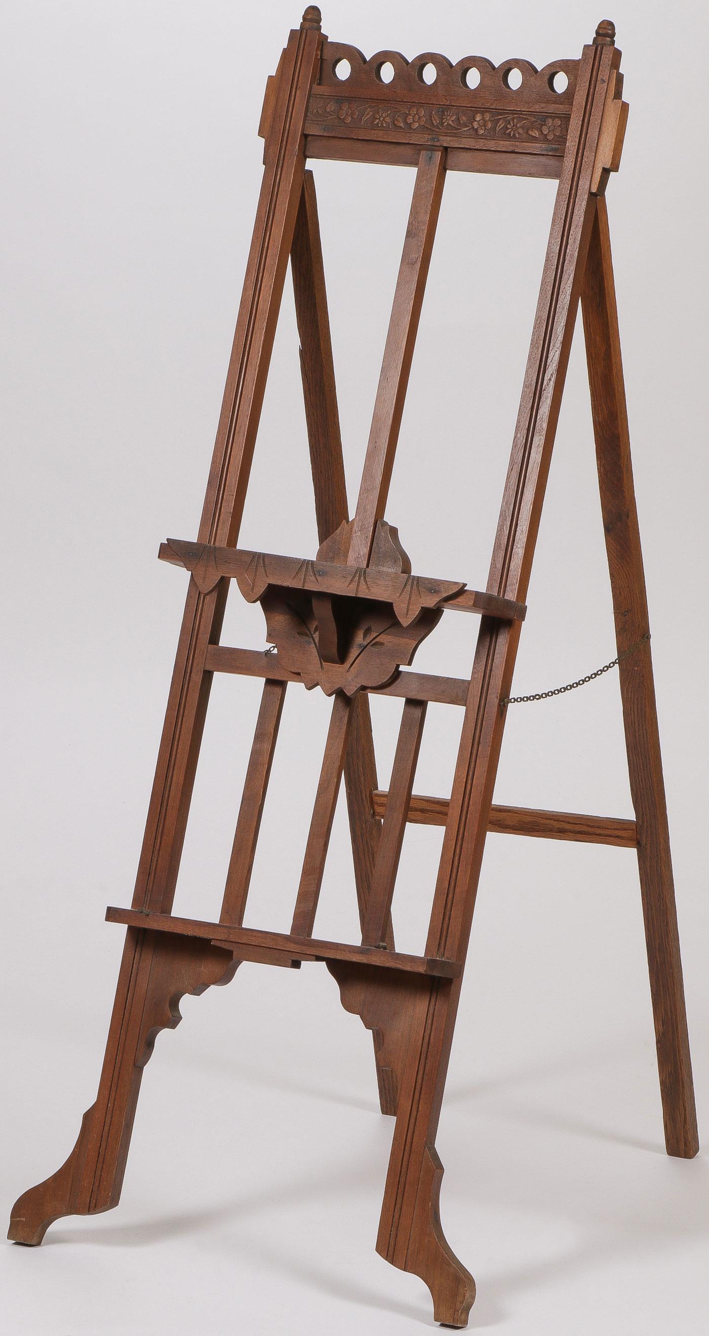 A VICTORIAN WALNUT EASEL: A VICTORIAN WALNUT EASEL. Height 50 inches, width 20 inches. SHIPPING NOTICE: Jackson's is your sole and only source for one stop packing and shipping. With over 50 years of experience, our profes