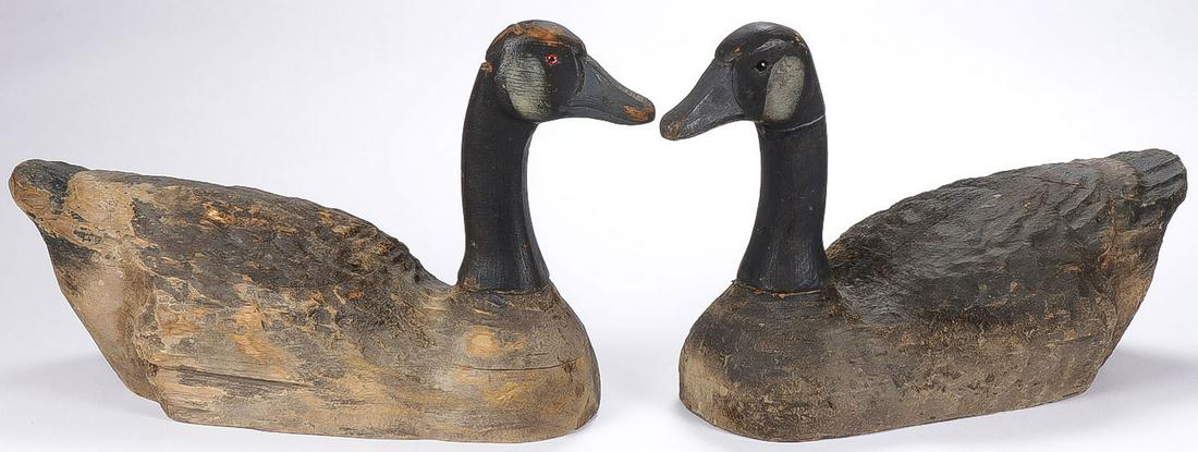 VINTAGE GOOSE DECOYS: VINTAGE GOOSE DECOYS. Comprising a pair of hand carved vintage Canadian geese decoys with glass set eyes, missing weights on bottom. Length 19 inches, height 12 inches. SHIPPING NOTICE: Jackson's