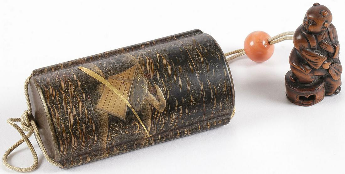 FINE JAPANESE LACQUER INRO, EDO: FINE JAPANESE LACQUER INRO, EDO. Comprising a five-section black lacquered inro with heavy gilt decoration depicting a marine scene, the interior of metallic rust hue, chord with likely coral Ojime be