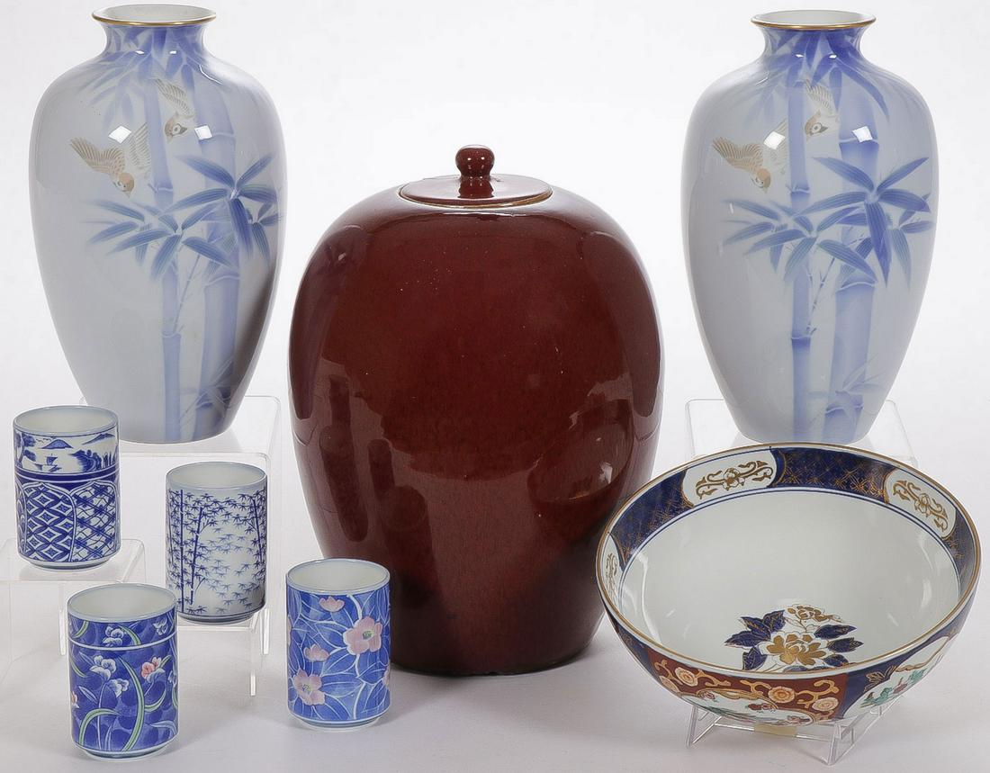 ASIAN CERAMICS GROUPING: ASIAN CERAMICS GROUPING. Comprising two matching vases with bamboo decoration and songbirds, each signed on underside of base, a large oxblood ginger jar with fitted lid (repaired), a set of four Japa
