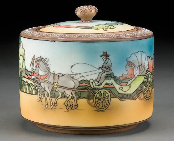 NIPPON COACHING SCENE PORCELAIN HUMIDOR: A GOOD HAND PAINTED NIPPON COACHING SCENE PORCELAIN HUMIDOR early 20th century. Blue maple leaf mark. Diameter 6 inches. Estimate $200-$400 Reference: The actual piece being offered is illustrated on 