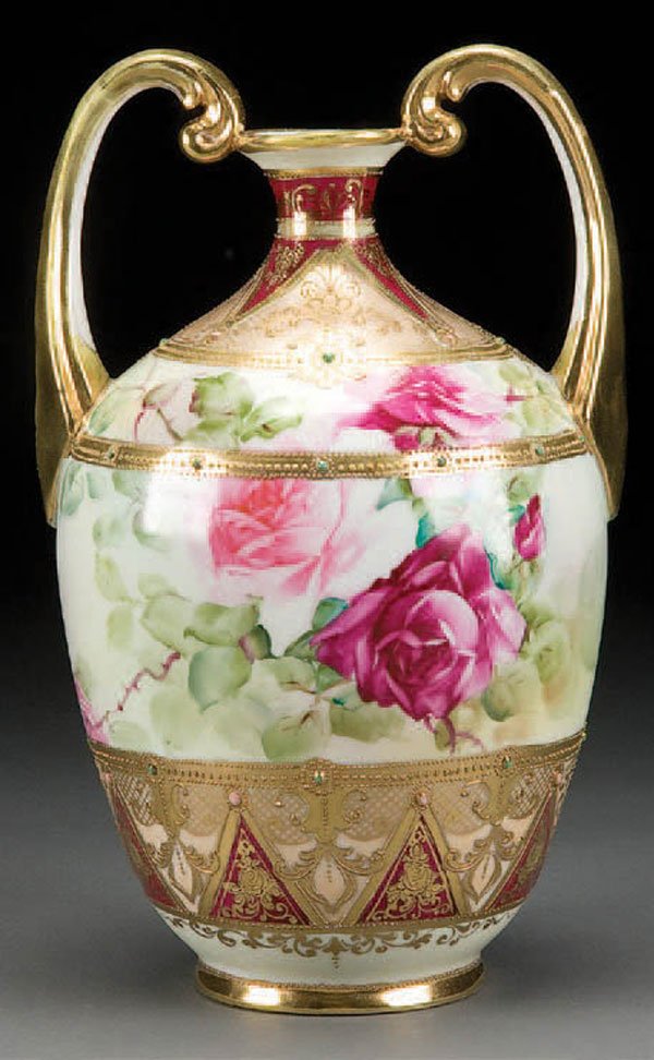 NIPPON JEWELED PORCELAIN VASE: A VERY FINE HAND PAINTED NIPPON JEWELED PORCELAIN VASE early 20th century, with red and pink roses within a gilt scroll and jeweled Vienna style decoration. Blue maple leaf mark. Height 10.75 inches. 