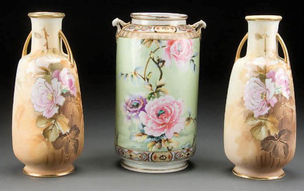 A GROUP OF 3 HAND PAINTED NIPPON PORCELAIN VASES: A GROUP OF 3 HAND PAINTED NIPPON PORCELAIN VASES early 20th century, each with rose decorated florals, two of matching form and decoration. Height 12.75 inches. Green maple leaf and EE marks. Estimate