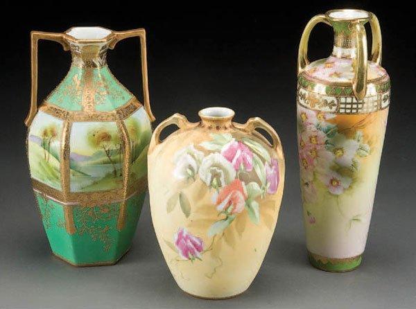 3 NIPPON FLORAL PORCELAIN VASES: 3 HAND PAINTED NIPPON FLORAL DECORATED PORCELAIN VASES early 20th century. Height 7.75 to 11.25 inches. Estimate $200-$400 Reference: The 3-handled vase with pink cherry blossoms is illustrated in Ser