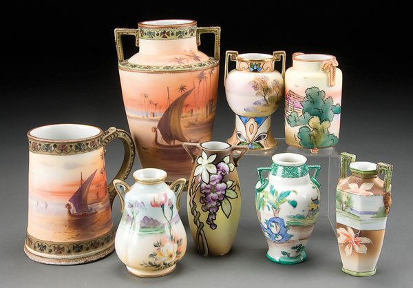 8-PIECE HAND PAINTED NIPPON PORCELAIN GROUP early: 8-PIECE HAND PAINTED NIPPON PORCELAIN GROUP early 20th century, consisting of a Nile scene 2-handled vase and matching mug. Together with 6 small cabinet vases. Green M in wreath and blue maple leaf m