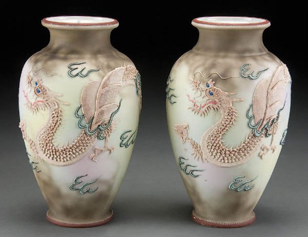 PAIR NIPPON MORIAGE DRAGONWARE VASES: A PAIR OF HAND PAINTED NIPPON MORIAGE DRAGONWARE MATCHING VASES early 20th century, with winged dragon in mottled cloud form. Blue pagoda mark. Height 9.25 inches. Estimate $250-$450