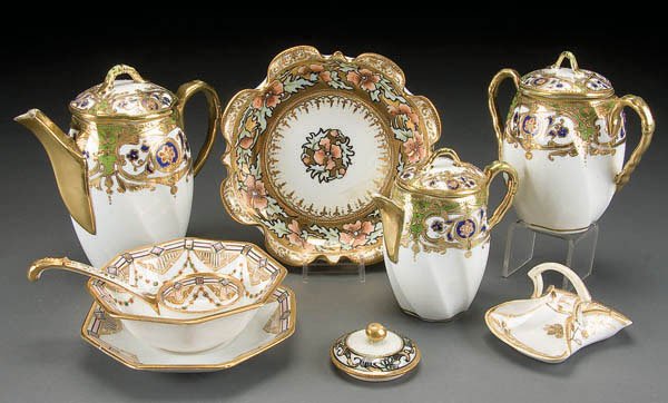 NIPPON GOLD DECORATED TABLEWARE GROUP: 9-PIECE HAND PAINTED NIPPON GOLD DECORATED TABLEWARE GROUP early 20th century, consisting of a matching demitasse pot, cream & sugar, together with a mayonnaise set, ruffled bowl and other items. Roya