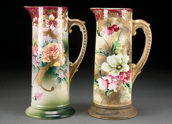 A PAIR OF ROYAL NIPPON CERAMIC TANKARDS early 20t: A PAIR OF ROYAL NIPPON CERAMIC TANKARDS early 20th century, with hand painted floral decoration. Royal Nishiki marks. Height 12 & 12.5 inches. Estimate $100-$200