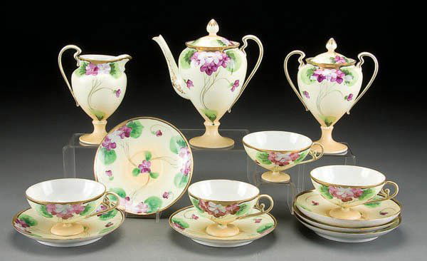 13-PIECE HAND PAINTED NIPPON FOOTED TEA SET early: 13-PIECE HAND PAINTED NIPPON FOOTED TEA SET early 20th century, with blue violet decoration. Te-Oh marks. Estimate $150-$250