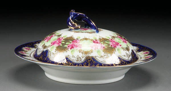 NIPPON COBALT & FLORAL COVERED PANCAKE SERVER: A HAND PAINTED NIPPON COBALT & FLORAL DECORATED COVERED PANCAKE SERVER raised star mark, diameter 9.5 inches. Estimate $50-$100