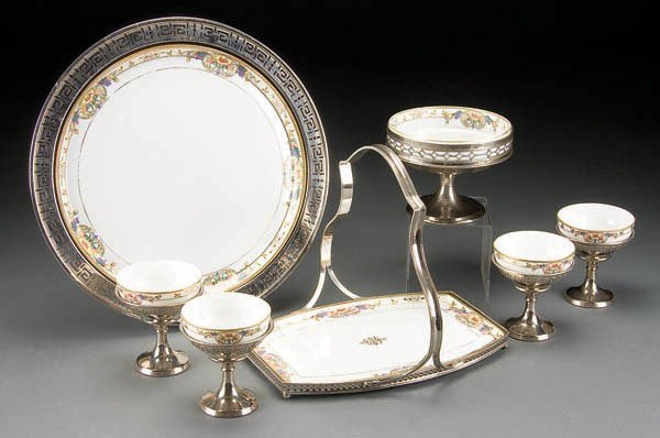 NIPPON & MANNING BOWMAN DESSERT SET: A HAND PAINTED NIPPON & MANNING BOWMAN DESSERT SET early 20th century, 6-piece consisting of Nippon floral decorated inserts in reticulated Manning Bowman nickel-plated holders. Comprising a 14-inch t