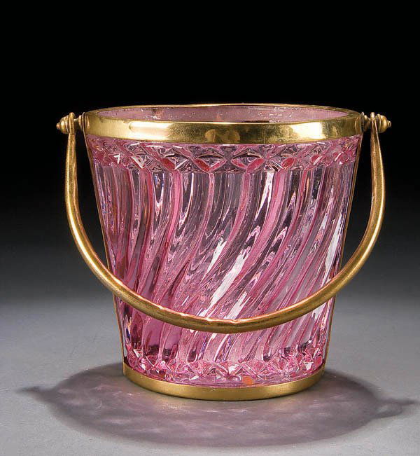 AN ALEXANDRITE GLASS ICE TUB with embossed swirl: AN ALEXANDRITE GLASS ICE TUB with embossed swirl decoration contained in a gilt metal frame. Height 5.5 inches. Estimate $75-$150