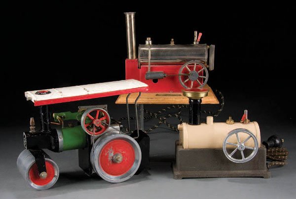 A MAMOD ROAD ROLLER TOY STREAM ENGINE MODEL circa: A MAMOD ROAD ROLLER TOY STREAM ENGINE MODEL circa 1920 together with a Weeden toy steam engine and an un-marked steam engine. Estimate $150 - $250
