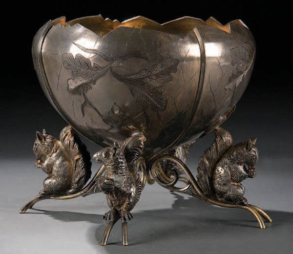 A FINE VICTORIAN SILVERED NUT BOWL. Late 19th Cen: A FINE VICTORIAN SILVERED NUT BOWL. Late 19th Century, of acorn form with chaised oak leaves supported by four scrolled legs mounted with four fully sculpted squirrel figures. Height 7". Estimate $150