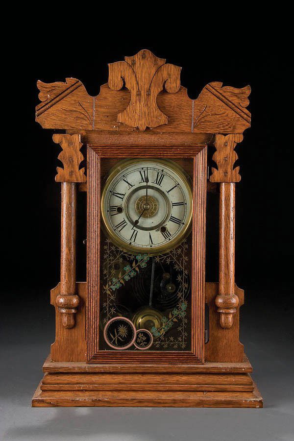 A OAK EIGHT DAY GINGER BREAD CLOCK by New Navy Li: A OAK EIGHT DAY GINGER BREAD CLOCK by New Navy Line Baltimore with molded and raised decoration and reverse hand painted design. Height 22 inches. Estimate $50 - $100