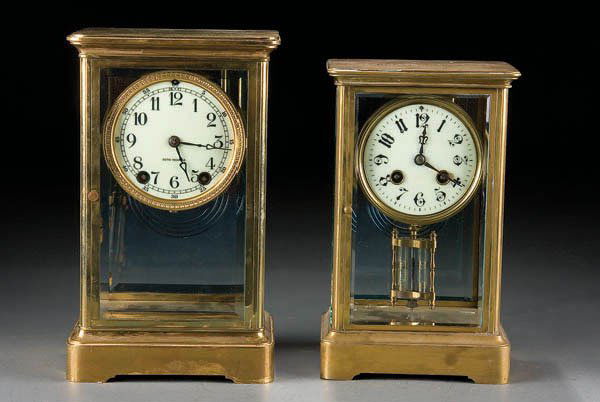 A PAIR OF CRYSTAL REGULATOR CLOCKS, including a S: A PAIR OF CRYSTAL REGULATOR CLOCKS, including a Seth Thomas 11 inch height crystal regulator together with a 10 inch French crystal regulator with bronze movements marked Japy Freres. Estimate $100 -