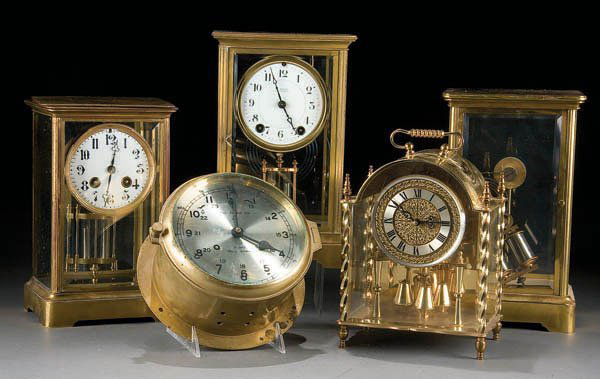 A GROUP OF FIVE BRASS AND CRYSTAL CLOCKS early 20: A GROUP OF FIVE BRASS AND CRYSTAL CLOCKS early 20th Century including Japy Freres, Seth Thomas and others by various makers. Height 10.75 inches. Estimate $100 - $150