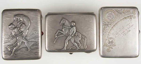 THREE RUSSIAN SILVER CIGARETTE CASES circa 1927-1: THREE RUSSIAN SILVER CIGARETTE CASES circa 1927-1954. The first with lid depicting lion slayer, gilded interior with Moscow hallmark, 875 standard, verso with engraved dedicatory inscription and with 