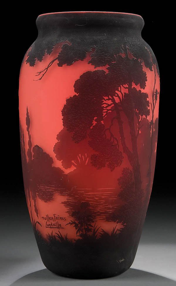 A GOOD MULLER FRENCH CAMEO GLASS VASE circa 1910.: A GOOD MULLER FRENCH CAMEO GLASS VASE circa 1910. Cylindrical shouldered form in red glass decorated with a crimson lake scene of tall trees and distant forested shoreline. Signed Muller Freres Lunevi