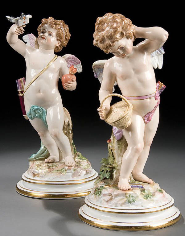 A PAIR OF LARGE MEISSEN PORCELAIN CUPID FIGURES m: A PAIR OF LARGE MEISSEN PORCELAIN CUPID FIGURES mid 19th century each finely modeled and painted depicting Cupid with heart and bird and Cupid with basket. Blue crossed pommel sword marks and incised