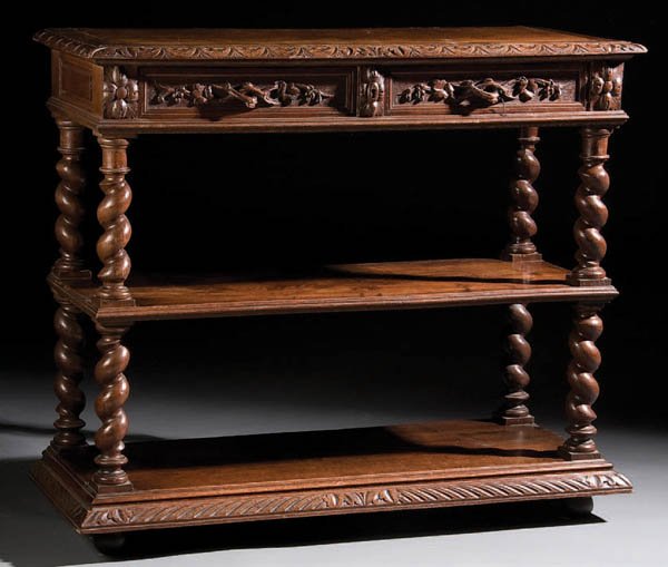 A SWISS CARVED "BLACK FOREST" STYLE OAK TWO SHELF