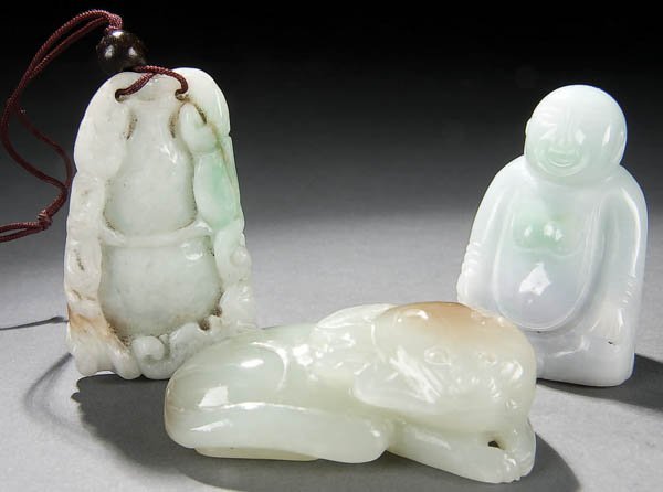 3 CHINESE CARVED JADE FIGURES 19th/20th century, : 3 CHINESE CARVED JADE FIGURES 19th/20th century, comprising a bottle-form pendant in light greens and tan, a reclining cat and bat hand piece in pale green and tan, and a seated Buddha in pale green w