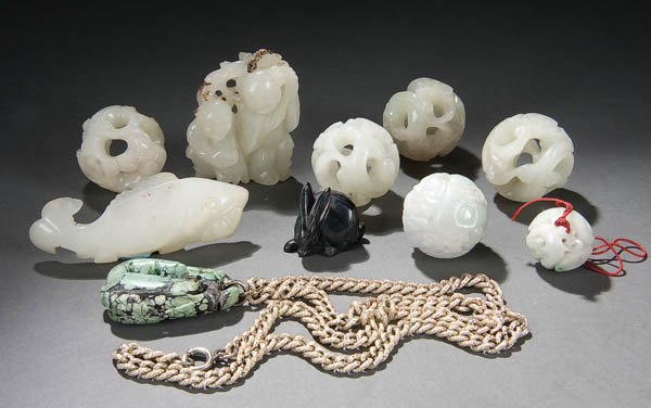A CHINESE CARVED JADE GROUP 20th century, compris: A CHINESE CARVED JADE GROUP 20th century, comprising six dragon balls, a pale green jade fish, a pale green pendant of two boys together with a carved turquoise pendant. The largest 2.5 inches long. E