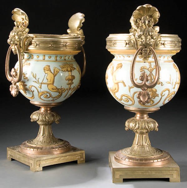 A PAIR OF FRENCH ORMOLU MOUNTED URNS 19th or 20th: A PAIR OF FRENCH ORMOLU MOUNTED URNS 19th or 20th century. Height 15 inches (38 cm). Height 15 inches (38 cm). Estimate $300-$500 Euro 200-300