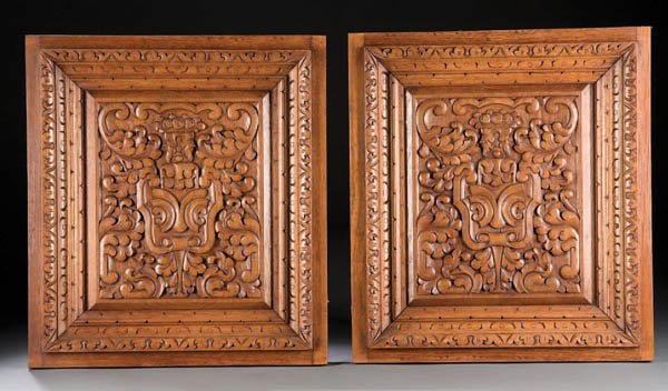 A PAIR OF AUSTRIAN CARVED WALNUT PANELS late 19th
