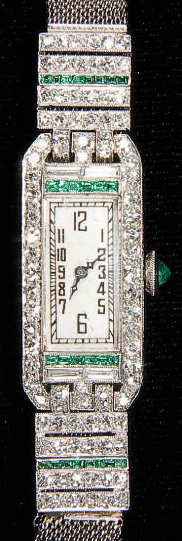 WATCH, A LADIES AUDEMARS PIGUET DIAMOND, EMERALD: WATCH, A LADIES AUDEMARS PIGUET DIAMOND, EMERALD AND PLATINUM ART DECO WATCH circa 1930. 17 jewel movement, serial number 367XX, contained in an unmarked platinum chased rectangular case mounted with