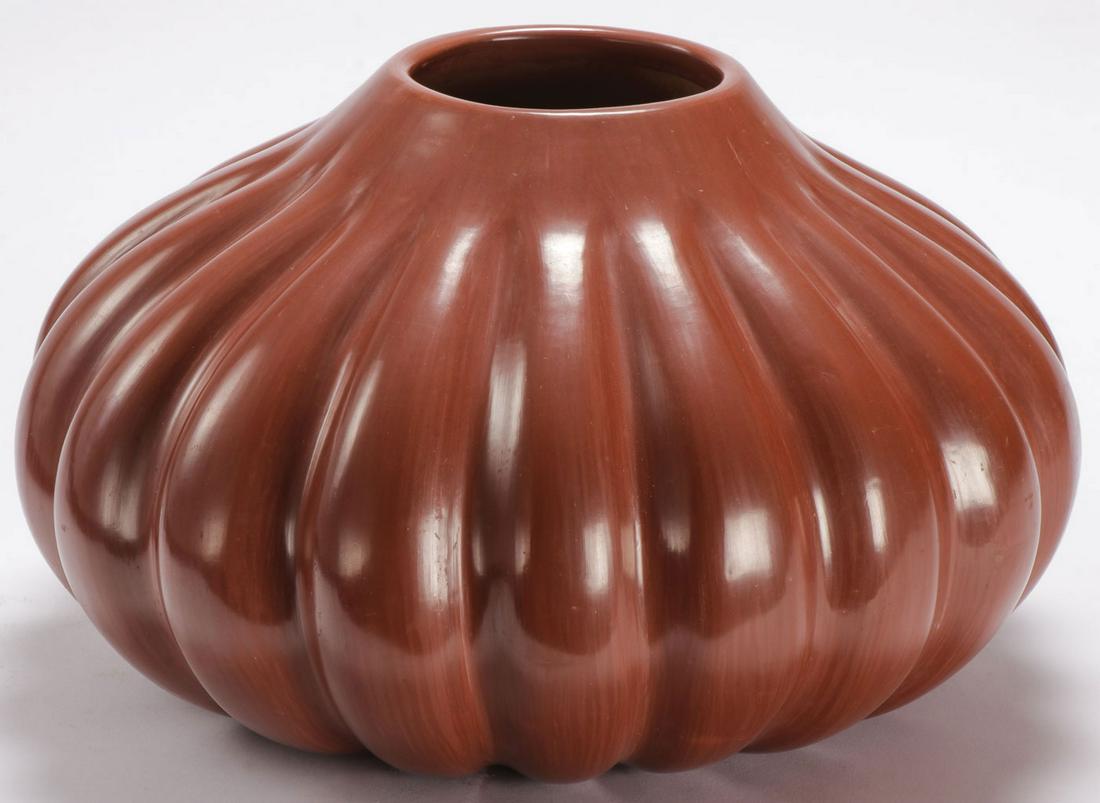 GREAT HELEN SHUPLA SANTA CLARA REDWARE JAR: GREAT HELEN SHUPLA SANTA CLARA REDWARE JAR. Comprising a large and impressive melon ribbed Santa Clara redware jar by noted potter Helen Shupla (1928-1985). Boldly signed on underside of base. Height