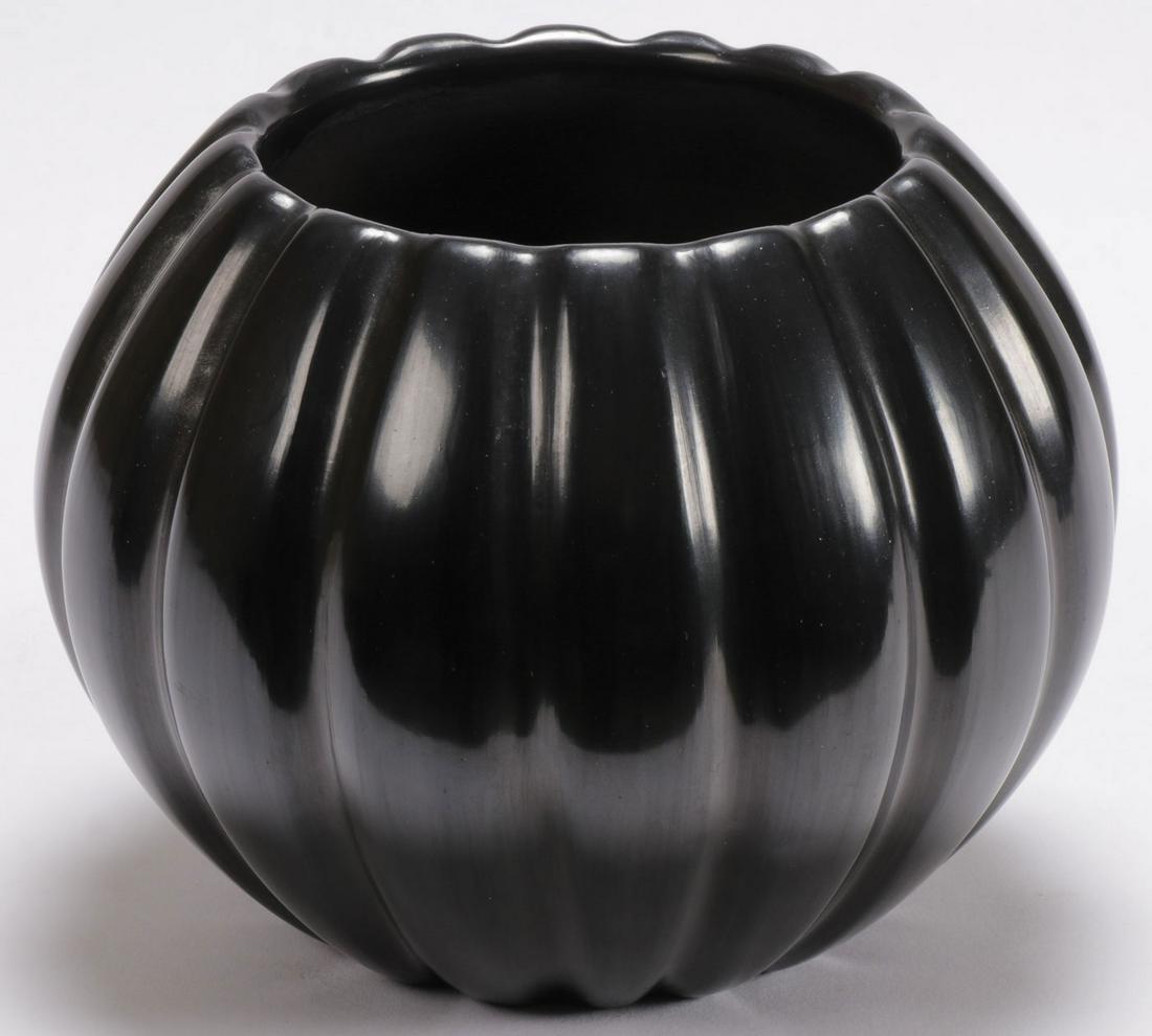 EARLY NATHAN YOUNGBLOOD SANTA CLARA JAR: EARLY NATHAN YOUNGBLOOD SANTA CLARA JAR. The blackware jar of ribbed melon form, underside of base signed and with cypher. Dated 11-17-78. Height 4.7 inches, diameter 6 inches. SHIPPING NOTICE: Jackso
