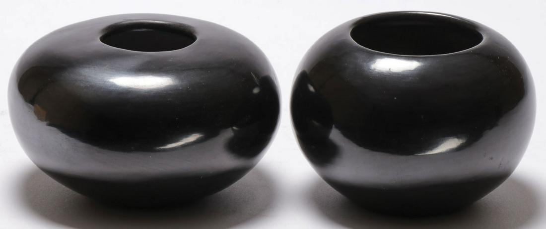 TWO SAN ILDEFONSO JARS: TWO SAN ILDEFONSO JARS. Comprising a squashed ovoid form, signed on bottom Wan Povi, height 3.25 inches, diameter 5 inches, together with a spherical form example signed on underside Maria Poveka, hei