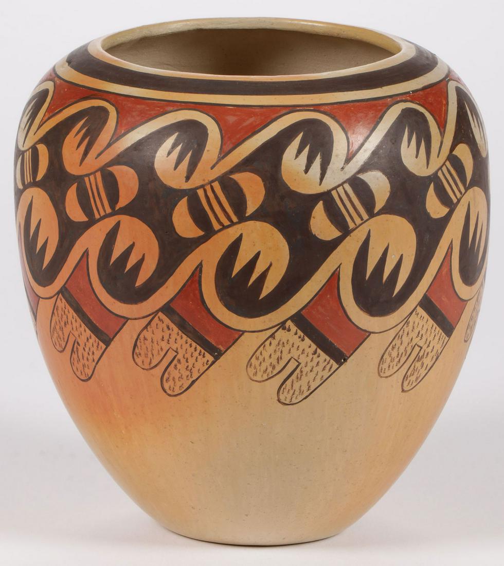 FANNIE NAMPEYO POLYCHROME JAR: FANNIE NAMPEYO POLYCHROME JAR. Of traditional form, the shoulder and sides banded in traditional repeating motifs, underside signed Fanny Nampeyo and with corn symbol. Height 6.2 inches, diameter 6.25