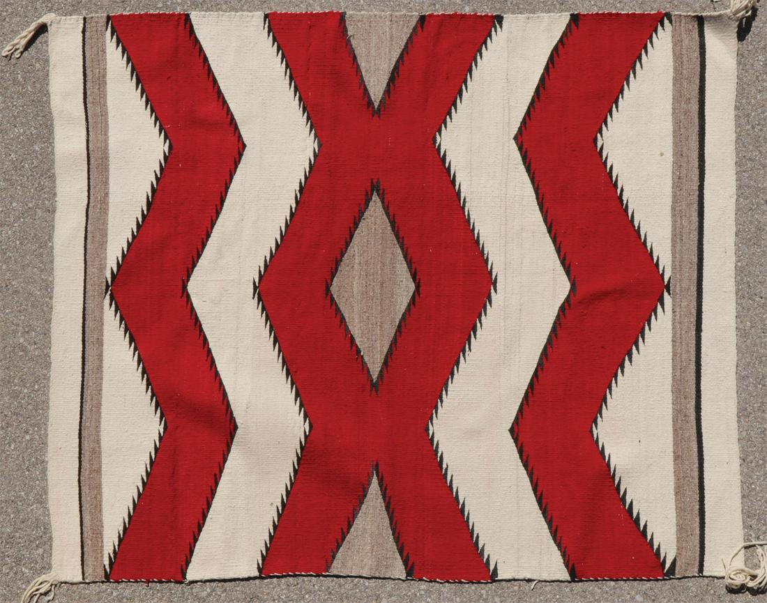 HANDSPUN NAVAJO WEAVING: HANDSPUN NAVAJO WEAVING. Comprising a handspun Navajo weaving, circa 1950, possibly a saddle blanket, 55 inches x 47 inches. SHIPPING NOTICE: Jackson's is your sole and only source for one stop packin